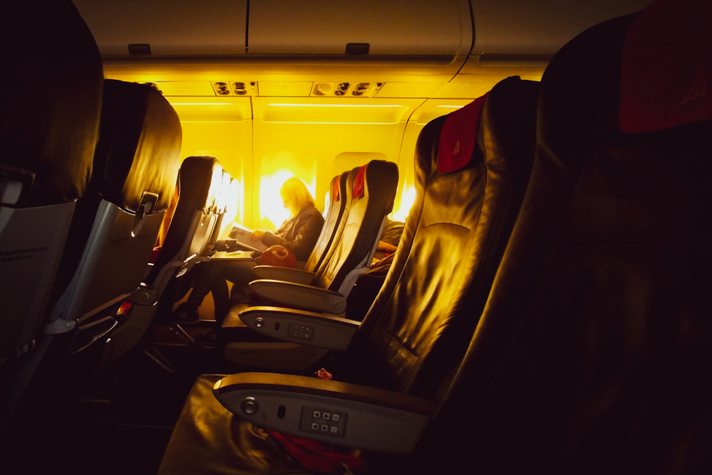 row of airplane seats in a flight for an international travel destination